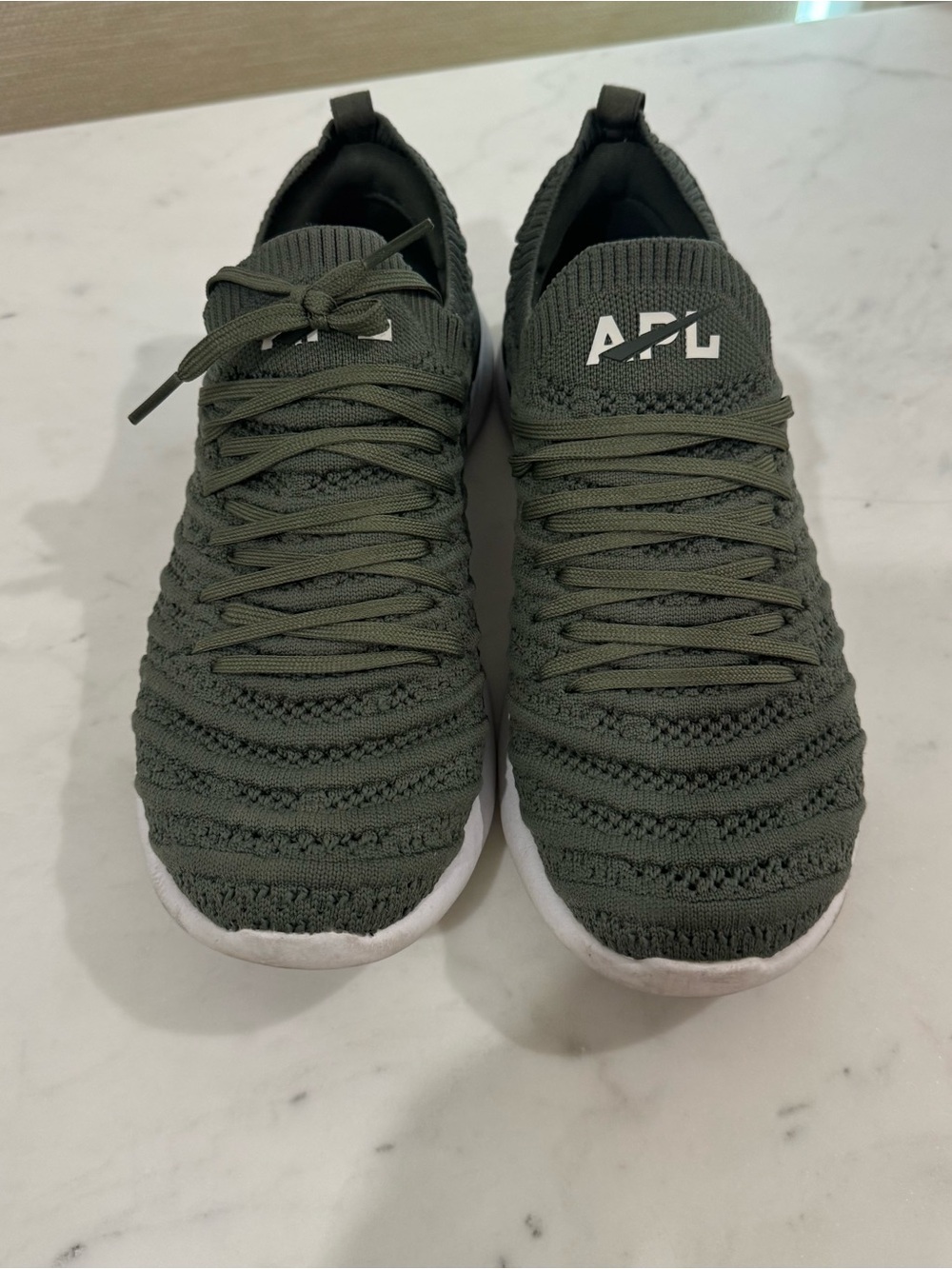APL women’s TechLoom Knit Sneakers in Olive green